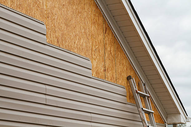 Professional Storm Damage Siding Repair technician working in Maineville, OH